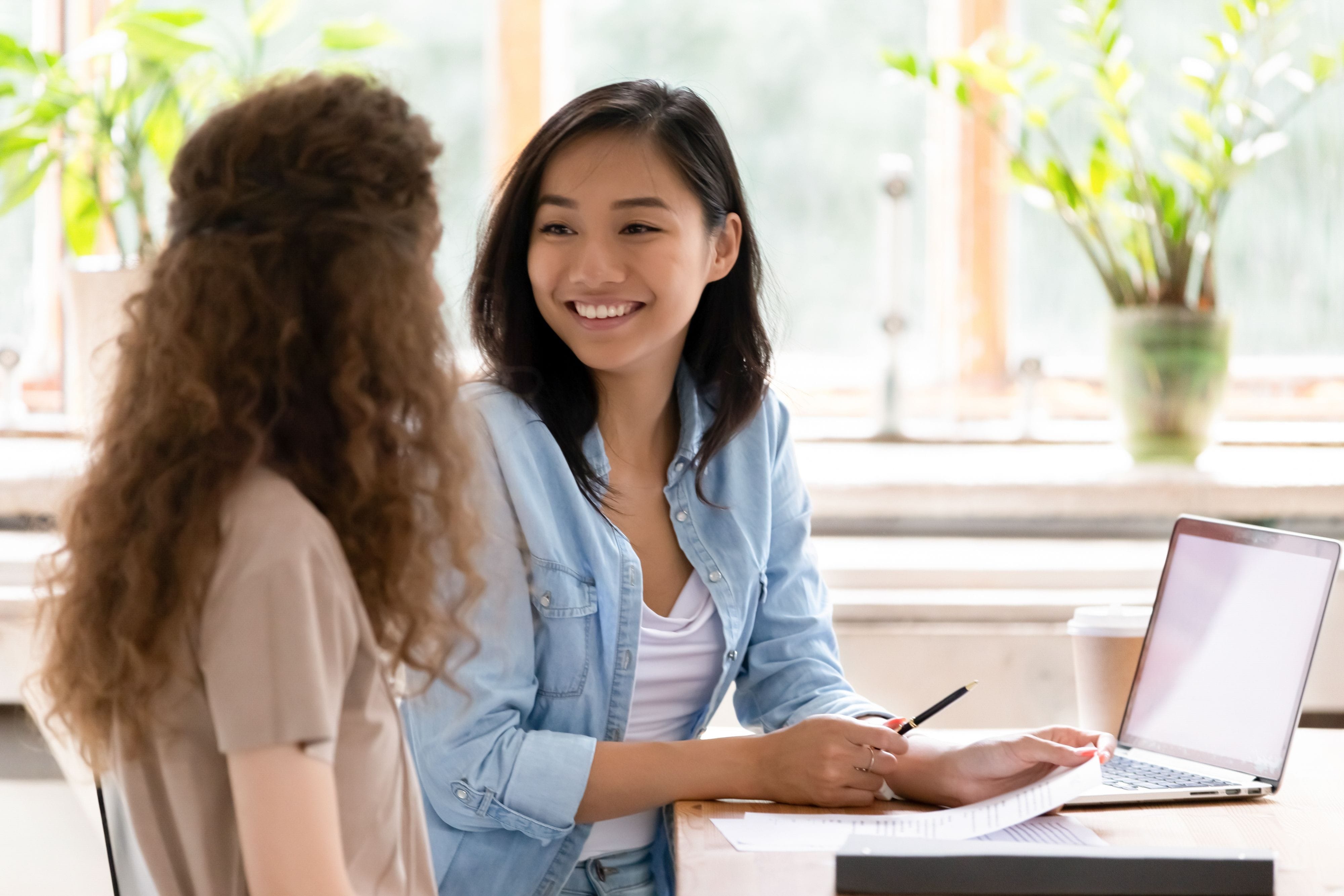 Woman Interviewing a Lady